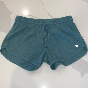 Green heather, athletic cozy shorts with drawstring, nicely fitted.